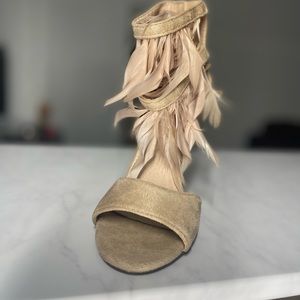 Nude feather heels, never worn.